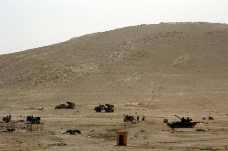 Des troupes syriennes déployées dans la ville syrienne de Palmyre le 24 mars 2016 . © AFP